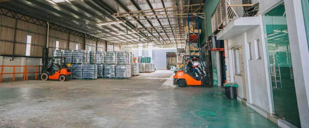 storage area of convention center with pallet forklift cars